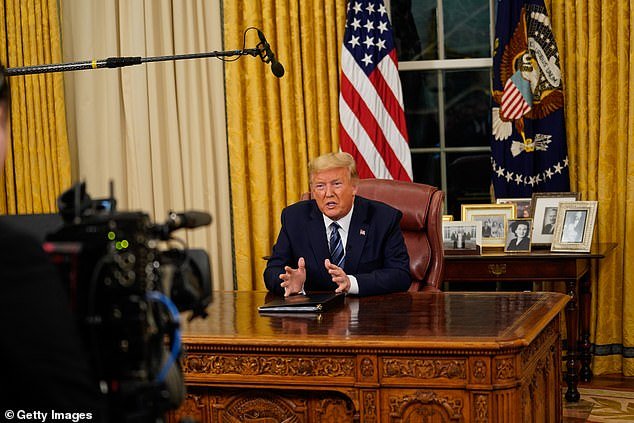 Moment of history: How Donald Trump addressed the nation from behind the Resolute desk, with a single camera and stills photographer allowed in the room