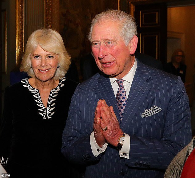 Prince Charles and Camilla, Duchess of Cornwall greet guests during the Commonwealth Reception at Marlborough House in London on Commonwealth Day on March 9
