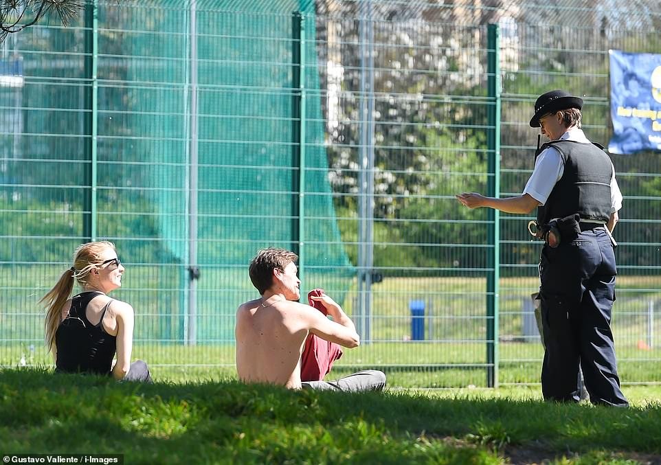 Thousands of Britons went to open spaces yesterday to enjoy the sun, including in Southwark Park in London
