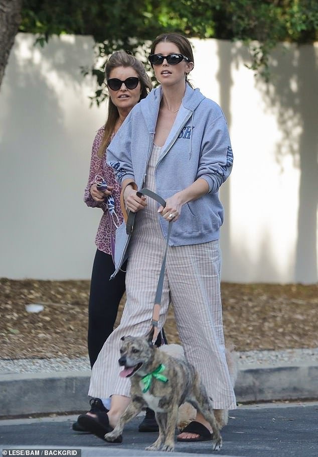 Out for a stroll: The potential baby news surfaces as Katherine was spotted out walking her dog with her mother Maria Shriver on Friday, sporting what looked to be a new baby bump