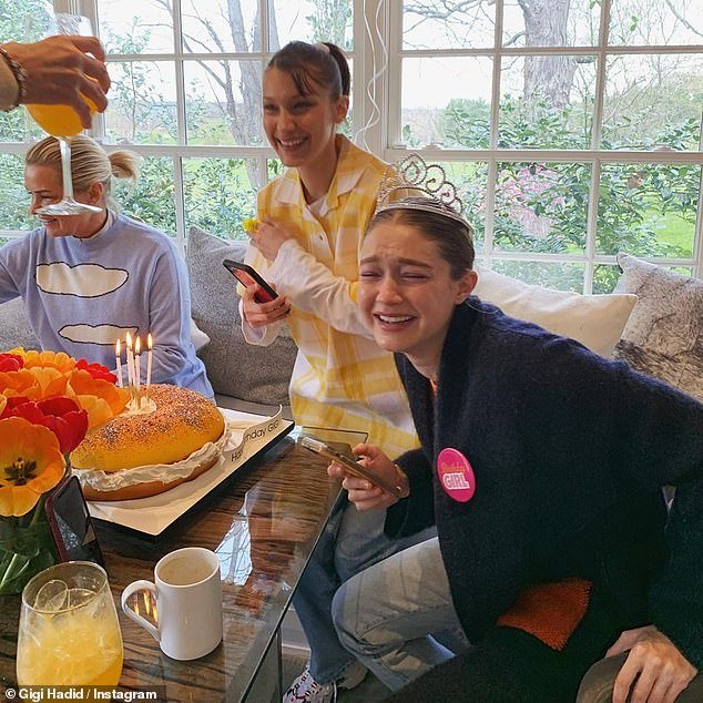 A happy lady: At her birthday breakfast, Gigi wore a tiara as she sat with Bella and her mother Yolanda Hadid