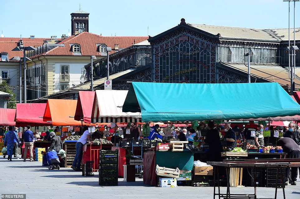 The Porta Palazzo market in Turin re-opened with social distancing rules today, as Italy relaxed a number of its most severe lockdown restrictions