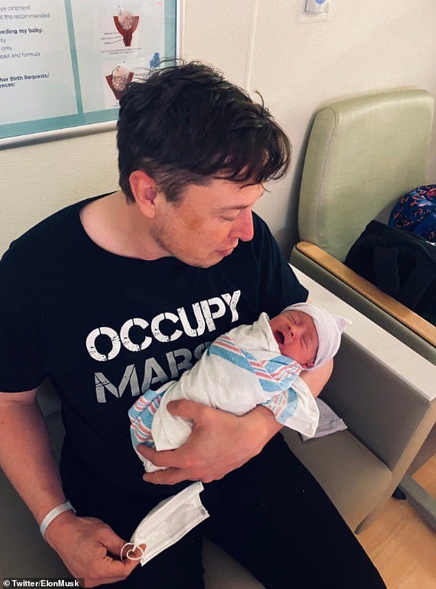 Musk, 48, announced the birth of his son with singer Grimes on Tuesday. He shared this photo of himself holding the newborn in his arms, telling fans the baby is called X Æ A-12