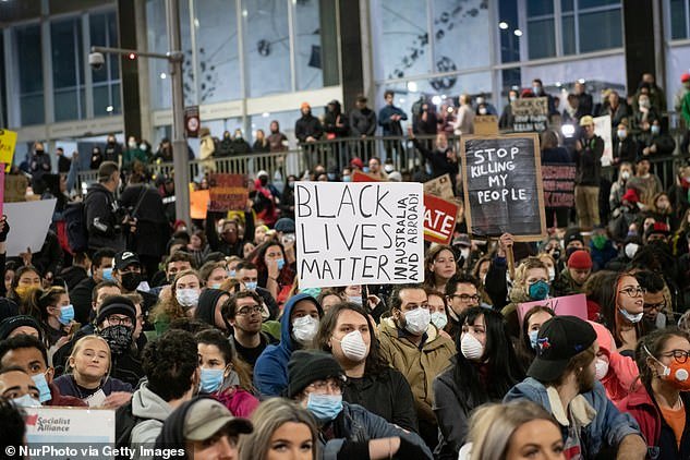 Tens of thousands of protesters marched through Australian cities in support of the Black Lives Matter movement. Pictured: A protest in Sydney on Tuesday