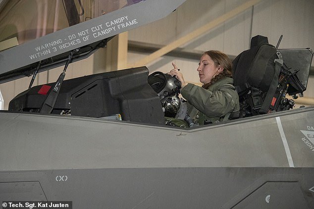 Thompson is seen above getting ready to go on her mission in this undated photo taken at Al Dhafra Air Base in the United Arab Emirates