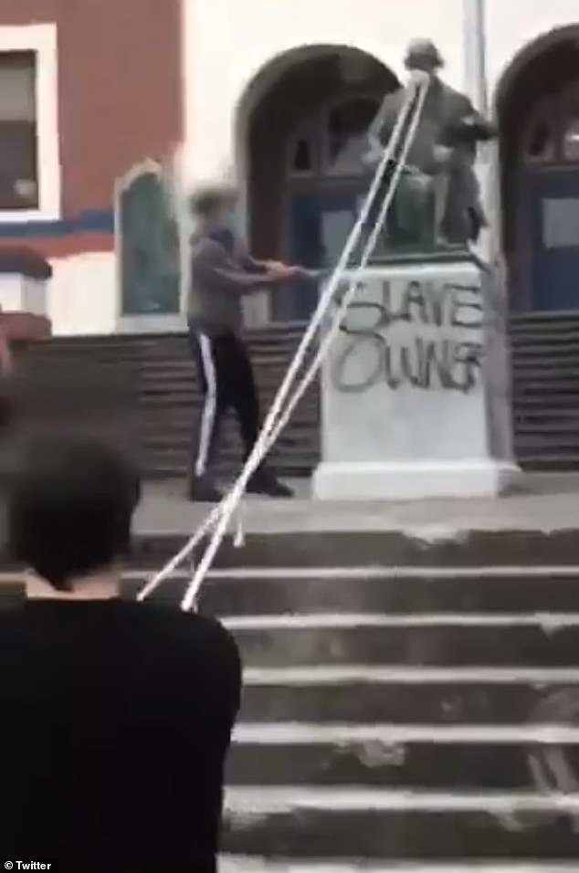 A group of at least nine people were seen on video removing the Thomas Jefferson statue on Sunday outside the high school