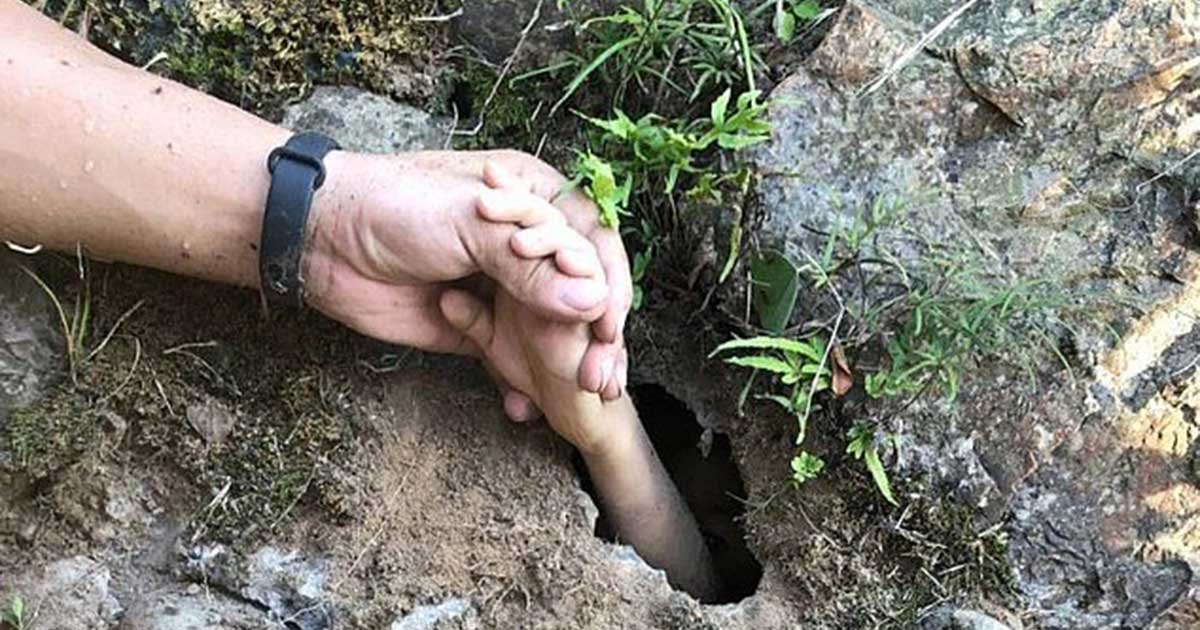 1 156.jpg?resize=1200,630 - Rescuers Saved Young Boy By Grabbing His Hand Through A Tiny Hole