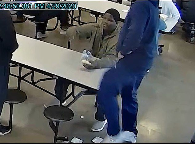 The footage released on Tuesday shows the moment Cornelius Fredericks, 16, was pushed to the floor and pinned down by staffers at the Lakeside Academy in Kalamazoo on April 29 just moments after throwing the sandwich