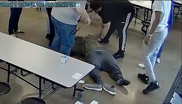 Toward the end of the video the teen appeared to be limp and fell back to the floor after some staffers attempted to sit him up