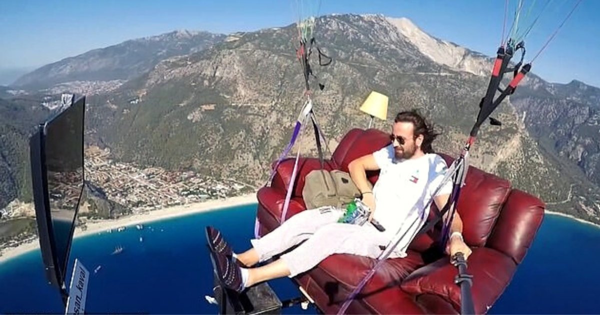fly5.png?resize=412,275 - Video Of Fearless Man Flying Around On A Sofa And Watching TV Without A Safety Harness