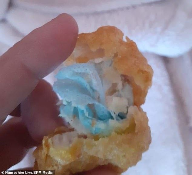 A furious mother claims her six-year-old daughter started choking on pieces of a disposable blue face mask cooked inside chicken nuggets she bought from McDonald