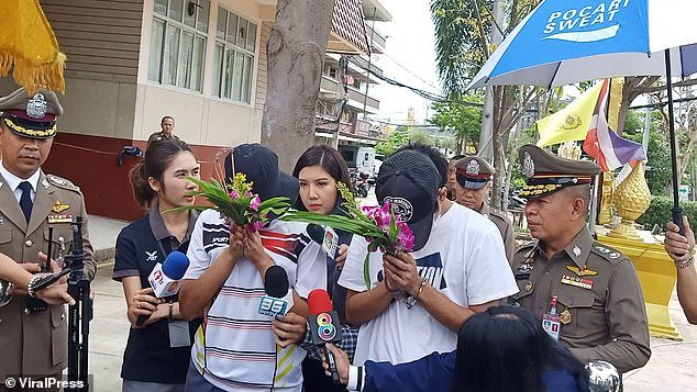 Aom and her boyfriend Jay, 23, pictured wearing white and hiding their faces with flowers and hats, were both arrested. The mother admitted murdering her daughter when she 