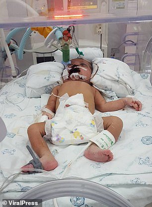 The newborn baby girl, pictured, was found by neighbours after being thrown into the bins and poisoned by her mother in Thailand. She died in hospital a few days later