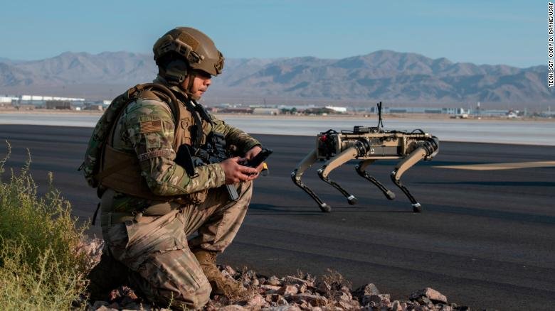 A Ghost Robotics Vision 60 unit operates with a US Air Force sergeant during an exercises at Nellis Air Force Base in Nevada.