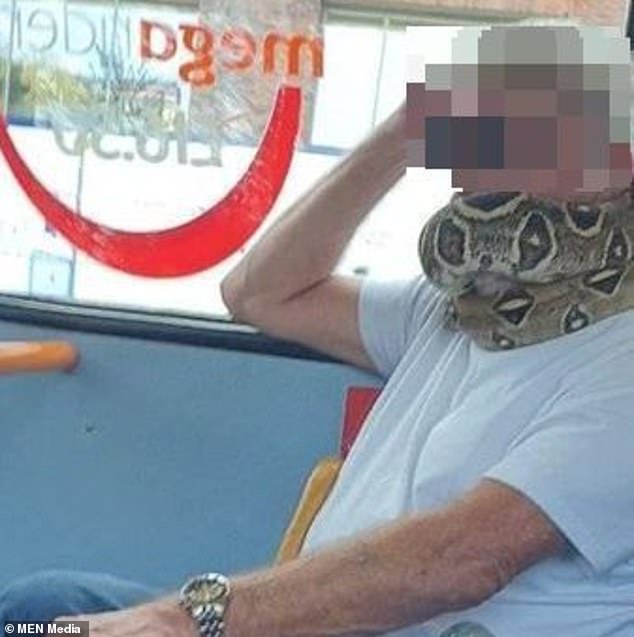 The man used the large reptile, which hung around his neck, as a face covering while boarding the Swinton to Manchester service at Salford precinct