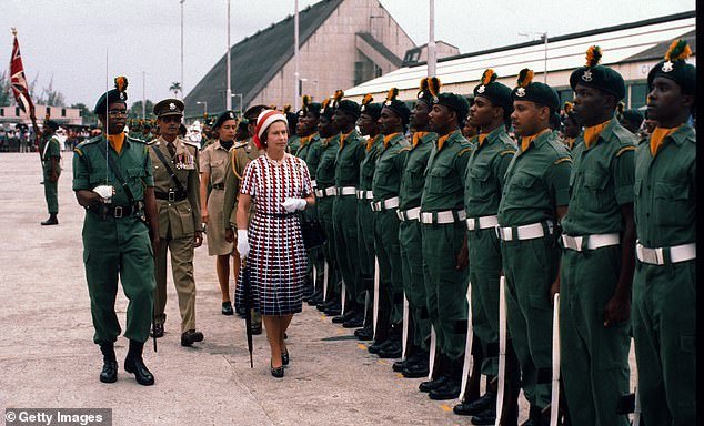 The Queen inspects a guard of honour upon arrival in Barbados in 1977