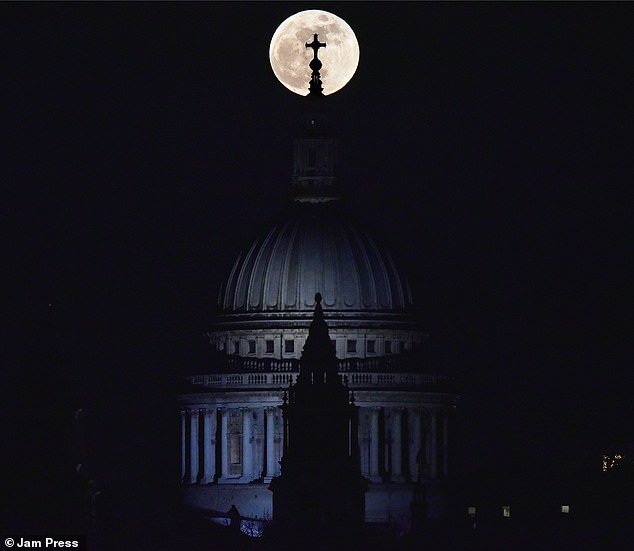 The moon is giving stargazers a treat on Halloween night with a Blue Moon that will be visible across all times zones. Our lunar neighbor will not shine blue, but the name is given because it is the second full moon to appear in the same month ¿ the first occurs October 1. Pictured is a Blue Moon from 2018 seen in London