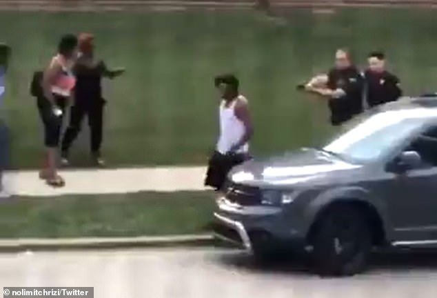Cellphone video captured by a bystander and posted online showed Sheskey and another officer following Blake with their guns drawn as he walked around the front of his parked SUV, opened the driver
