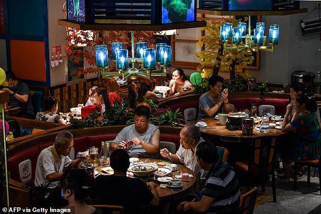 Without telling her date in advance, the Chinese woman showed up with 23 family members and turned their intimate dinner into a banquet. In this file photo, people are seen enjoying their meals at a restaurant in Wuhan, Central China