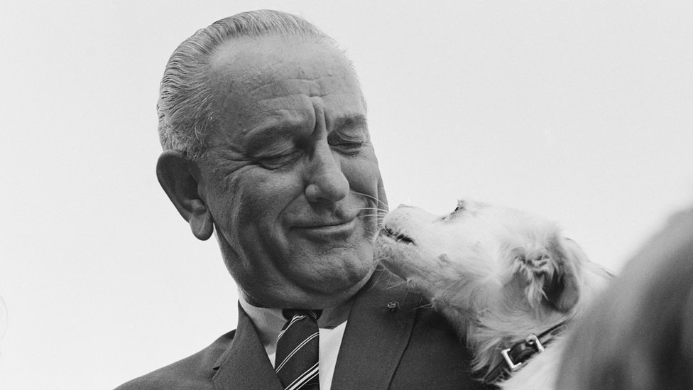 US President Lyndon B Johnson introduces his pet dog Yuki at a Country Fair on the South Lawn of the White House, Washington, DC, September 1967.