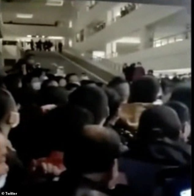 An airport in China was plunged into chaos (pictured) today after a worker tested positive for Covid-19 prompting officials to order airport-wide testing, witnesses claim