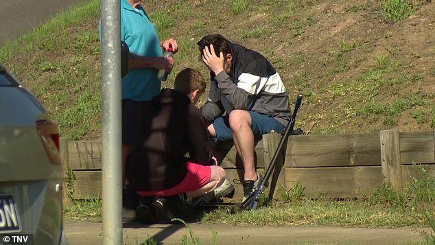 A man was seen being consoled after witnessing the horrific crash that killed Lucinda King, 10