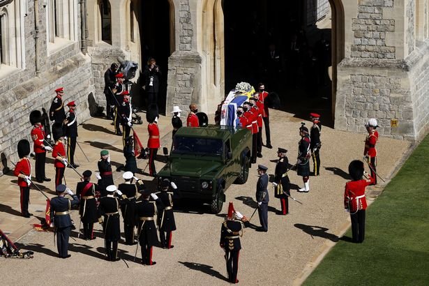 The Duke of Edinburgh’s coffin, covered with His Royal Highness’s Personal Standard is carried to the purpose built Land Rover during the funeral of Prince Philip, Duke of Edinburgh at Windsor Castle on April 17, 2021