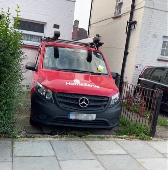 One van can be seen parked in a driveway with a yellow ticket on its windscreen