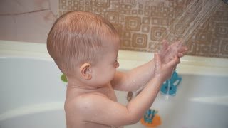 Happy siblings: four little children playing together with water by taking  bath in bathtub at home Stock Video Footage - Storyblocks