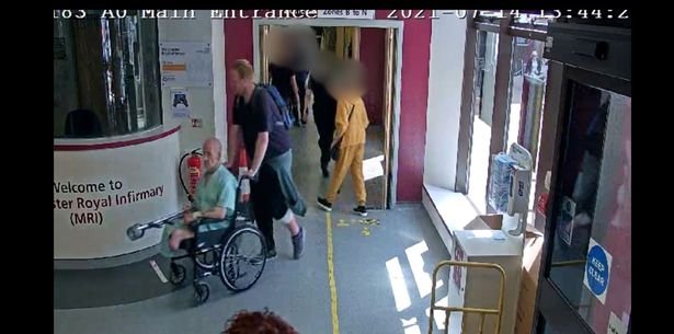 This is the moment Liam Dallimore wheels defenceless double amputee George McEwans-Jones out a busy hospital to rob him
