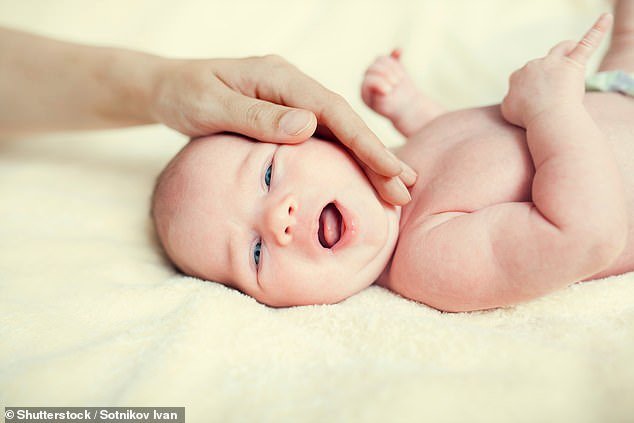 Parents who naturally stroke their babies when they are in pain may help to reduce their discomfort | Daily Mail Online