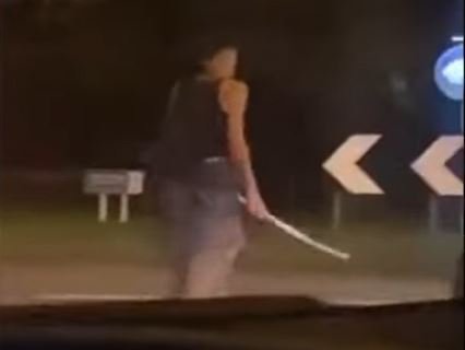 A man was filmed brandishing a samurai-style sword