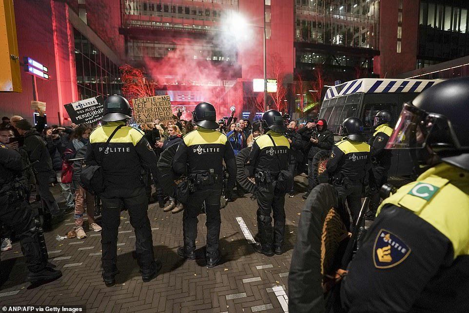 Hundreds of anti-lockdown protestors clashed with riot police in The Hague in the Netherlands on Friday evening as a raft of new lockdown measures were announced and due to come into force from Saturday