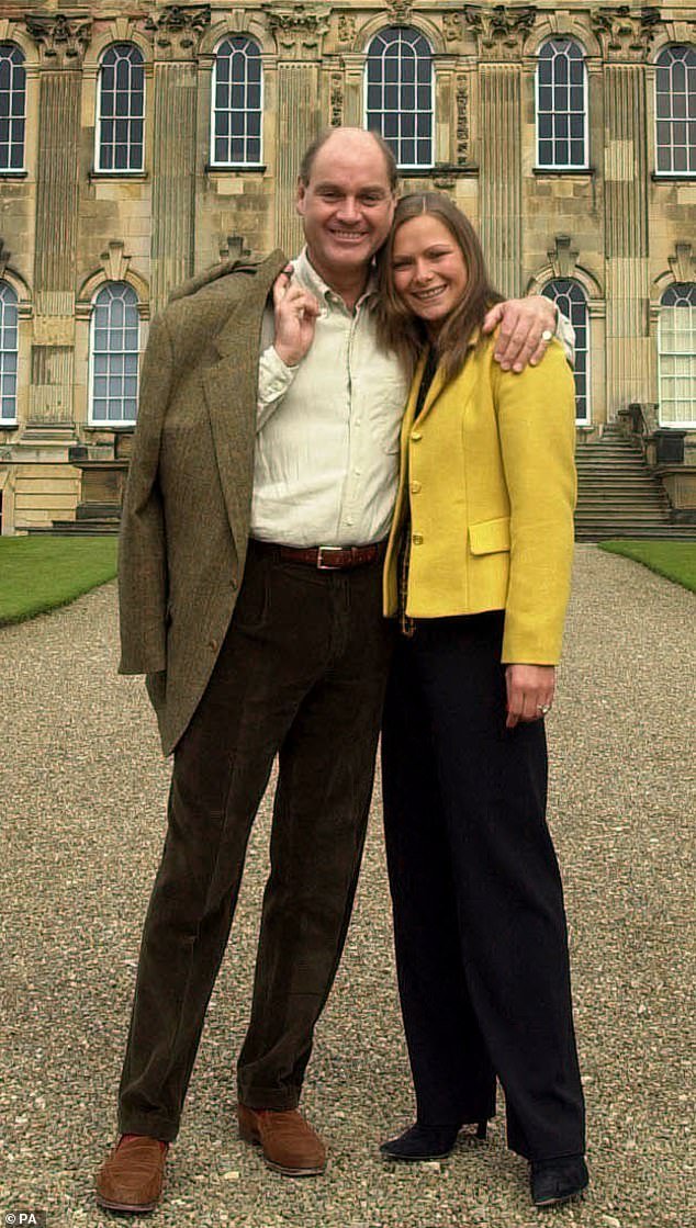 Howard (left) pictured with his second wife Rebecca Howard (right), who he has two children with, outside Castle Howard