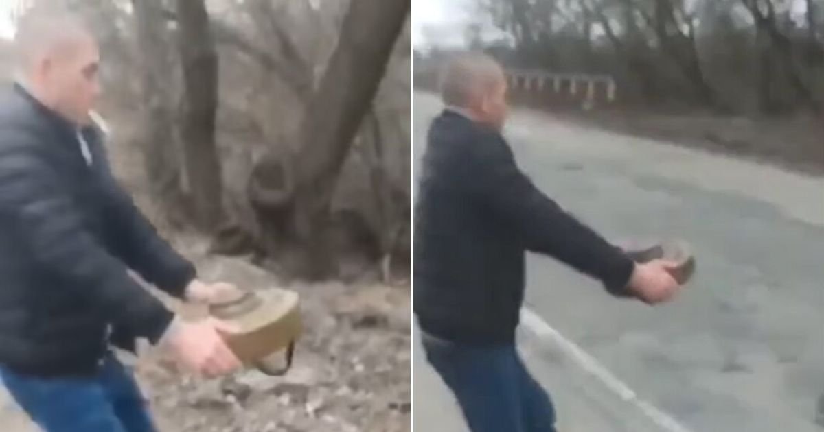 untitled design 55 1.jpg?resize=412,275 - Chilling Moment Ukrainian Man Picks Up An Anti-Tank Mine With His Bare Hands While Smoking A Cigarette