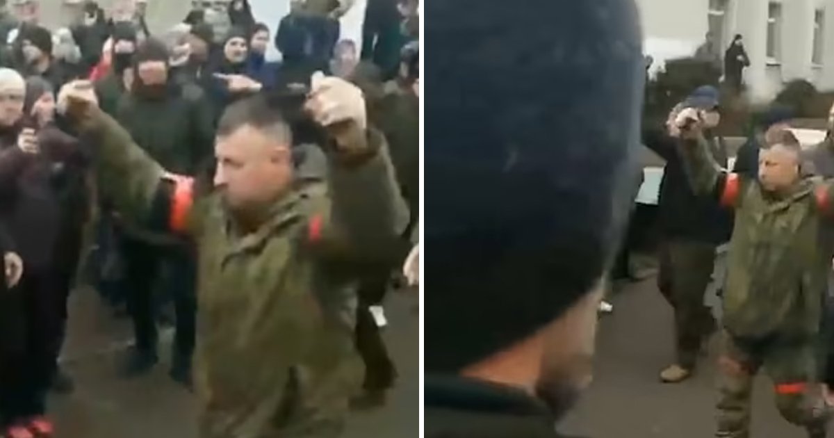 d9.jpg?resize=412,275 - JUST IN: Russian Soldier Holds Two GRENADES Above His Head & Walks Through Crowd Of Furious Ukrainian Citizens
