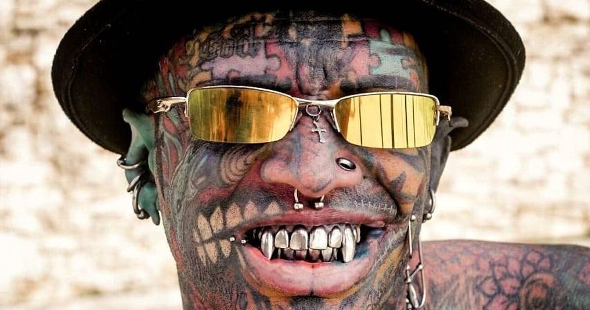 tats5.jpg?resize=412,232 - Grandfather Spends $40,000 Getting Tattoos On 98 Percent Of His Body, Including Gums And Eyeballs