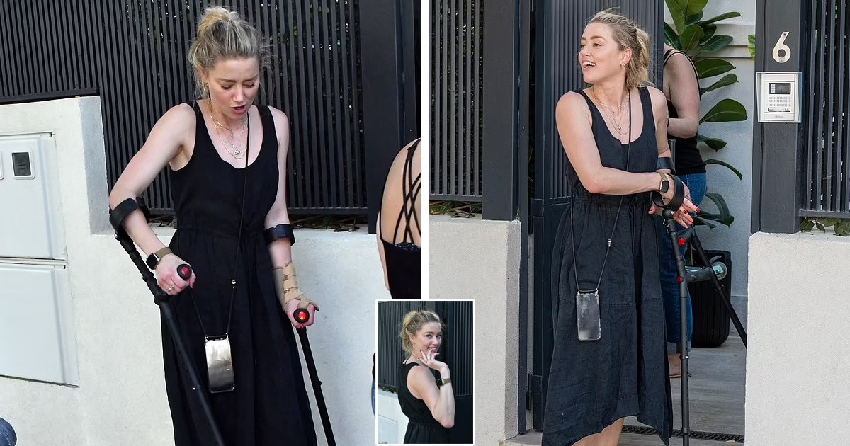 d70.jpg?resize=412,275 - BREAKING: Amber Heard Pictured Hobbling On NYC's Streets Using Crutches