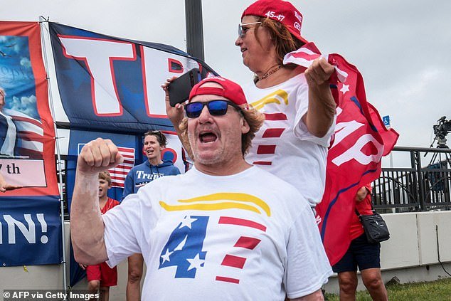 Supporters of Donald Trump cheer for their candidate near his  Mar-a-Lago estate in Florida