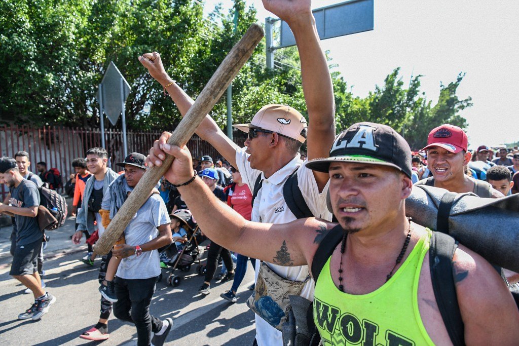 Migrants of varying nationalities in a caravan, walking along a highway in Tuxtla Gutierrez, Chiapas State, Mexico, en route to the United States on November 5, 2024.